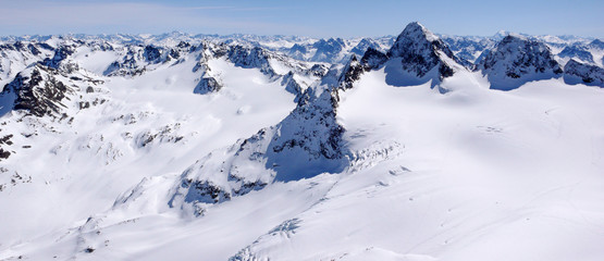 Poster - winter mountain landscape in the Silvretta mountain range in the Swiss Alps with famous Piz Buin mountain peak in the center