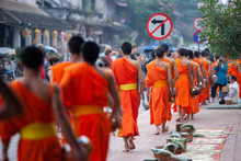 Buddhist Novice Monks With Buddhist Alms Giving Ceremony At Luang Prabang.
