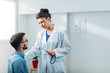 © Suteren Studio - Woman Doctor talking to Patient at her Medical Office