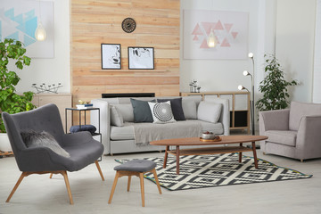 Sticker - Stylish living room interior with comfortable couch and decorative elements