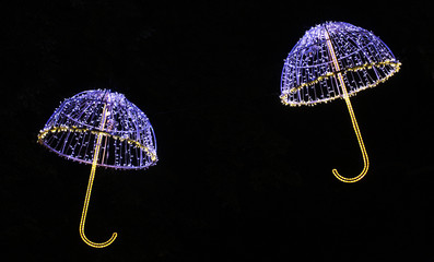 Two umbrellas in the dark