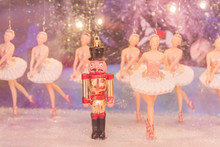 Christmas Nutcracker Toy Soldier And Balerina Dolls On The Stage. Famous Russian Ballet Installation.