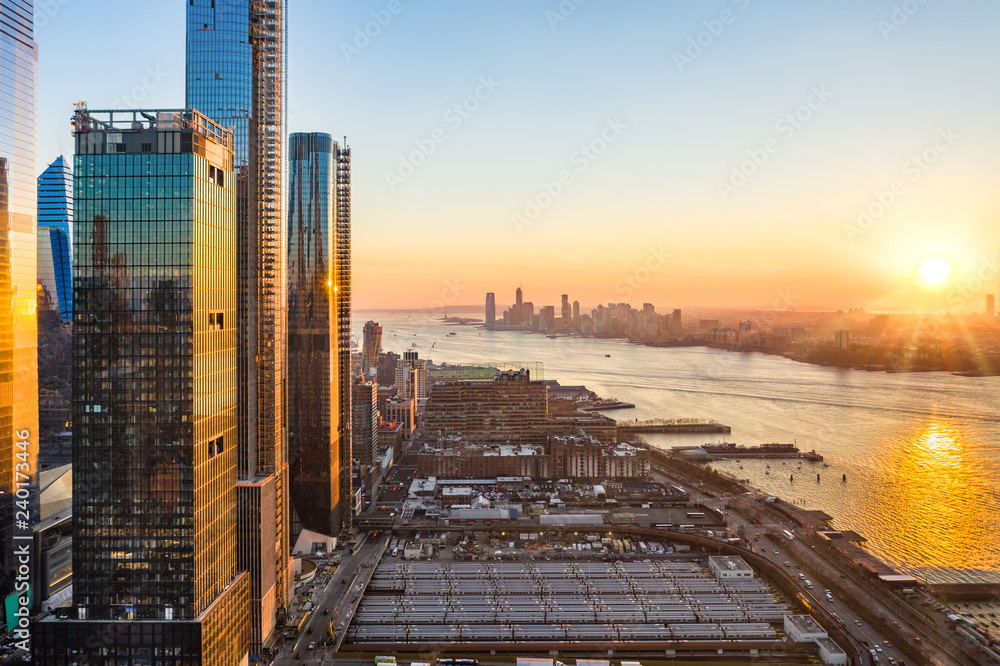 Aerial New York City waterfront skyline at sunset viewed from Hudson ...