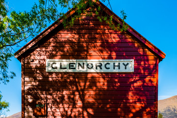 Poster - Iconic red building and Beautiful scenery beside the lake at Glenorchy, New Zealand.