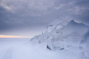 Wall Mural - a snowstorm on the surface of the frozen sea, the wind carries snowflakes through the ice floe.