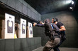 © OscarStock - Police training in shooting gallery with short weapon.