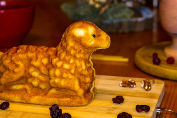 Wall Mural - preparation of treats for traditional Orthodox Christmas - handmade baked cookies in the form of lambkin, dried fruits, cranberries, honey, nuts, rice pudding, mortar with poppy seeds, Church candles