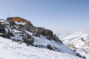 Poster - winter mountain landscape in the Monte Rosa range in Switzerland with the Mantova mountain hut on ist rocky promontory