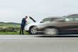 © phpetrunina14 - man stand near broken car with opened hood. emergency service
