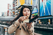 japanese girl worker trying the tasty takoyaki