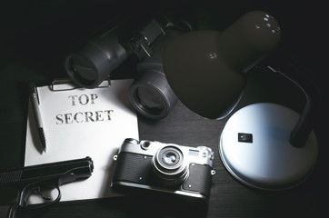 Wall Mural - top secret information data on the secret service agent table background. espionage concept.