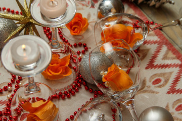 Romantic composition with wine glasses and fake flowers