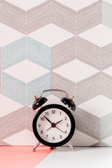 Wall Mural - Vintage background with retro alarm clock on table