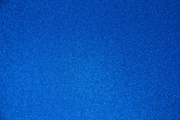 An abstract blue background made of twinkling glitter that is great for a background for Christmas and other celebrations.