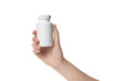 Woman holding bottle of pills on white background, closeup