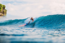 Surf Girl On Surfboard. Surfer Woman Dropped From Surfboard And Blue Wave