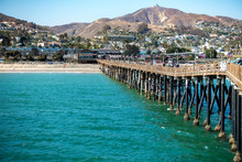 Pier At Beach And City