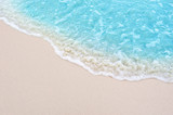 Fototapeta Morze - beautiful sandy beach and soft blue ocean wave