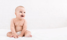 Cute Baby Sitting On White Background, Copy Space