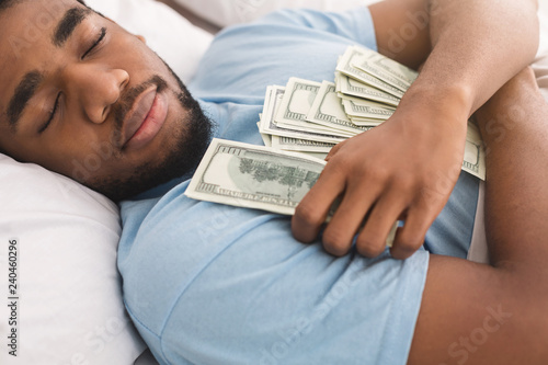 Fotografía Man sleeping with lots of currency notes