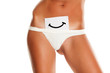 © vladimirfloyd - Woman with panties cowers her vagina with smile drawn on sheet of paper on white background