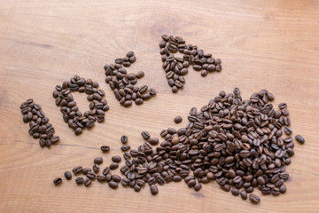  Idea conceptional sign drawn among brown roasted coffee beans