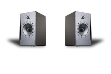 Two sound speakers with shadows on a white background isolated