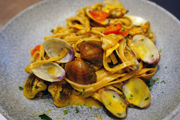 Wall Mural - Dish of fresh pasta with seafood and shellfish in Italy