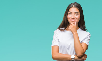 Poster - Young beautiful arab woman over isolated background looking confident at the camera with smile with crossed arms and hand raised on chin. Thinking positive.