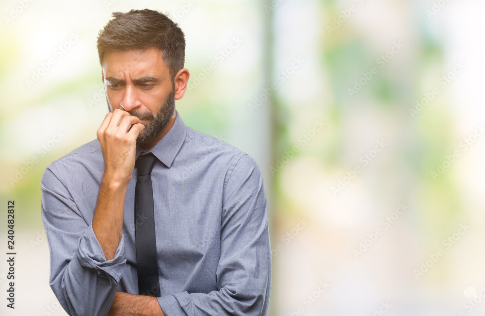 Adult hispanic business man over isolated background looking stressed and nervous with hands on mouth biting nails. Anxiety problem. - obrazy, fototapety, plakaty 