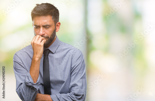 Fotografía Adult hispanic business man over isolated background looking stressed and nervous with hands on mouth biting nails