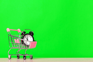 classic alarm clock in a shopping cart