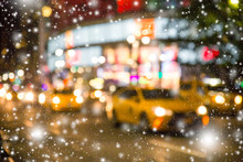 Defocused Blur New York City  Manhattan Street Scene With Yellow Taxi Cabs And Snowflakes Falling During Winter Snow Storm