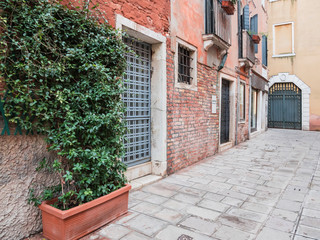 VENICE, ITALY, Nov 1st 2018: Renaissance architecture closeup perspective exterior or facade view on venetian street or inside garden. Nobody. Classic italian cityscape.