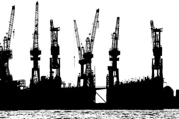 Silhouette of cranes in Hamburg Harbor, Germany,  in black and white.