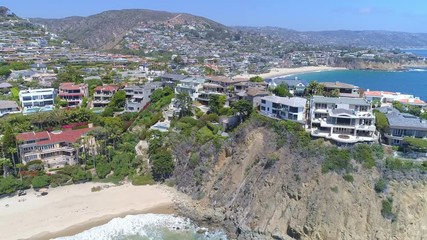 Wall Mural - Aerial view of Laguna Beach luxury real estate in Orange County, California from above on beautiful clear blue sky day.