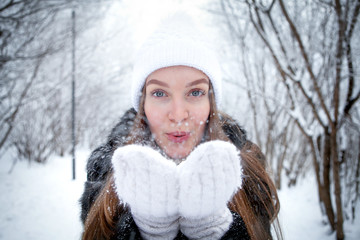 Beautiful girl in winter forest. Frosty, snowy forest.Girl in Russian winter forest.