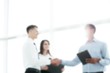 © yurolaitsalbert - friendly business people shaking hands on blurred background