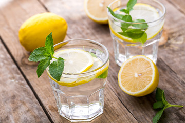 Fresh Lemonade in a Glasses with Lemon Slices and mint