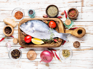 Wall Mural - Raw fish and ingredients for cooking