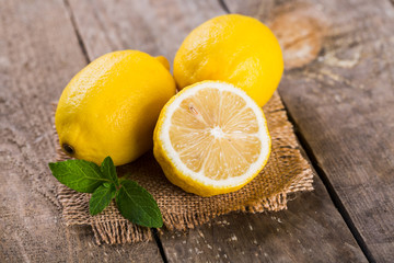 Lemon and mint on an old wooden table