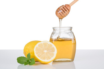 Honey, lemon and mint on white background. Fruit, citrus