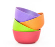 colored plastic bowls on white background