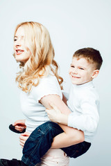 young modern blond curly mother with cute son together happy smi