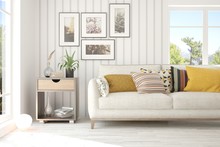 Idea Of White Room With Sofa And Summer Landscape In Window. Scandinavian Interior Design. 3D Illustration