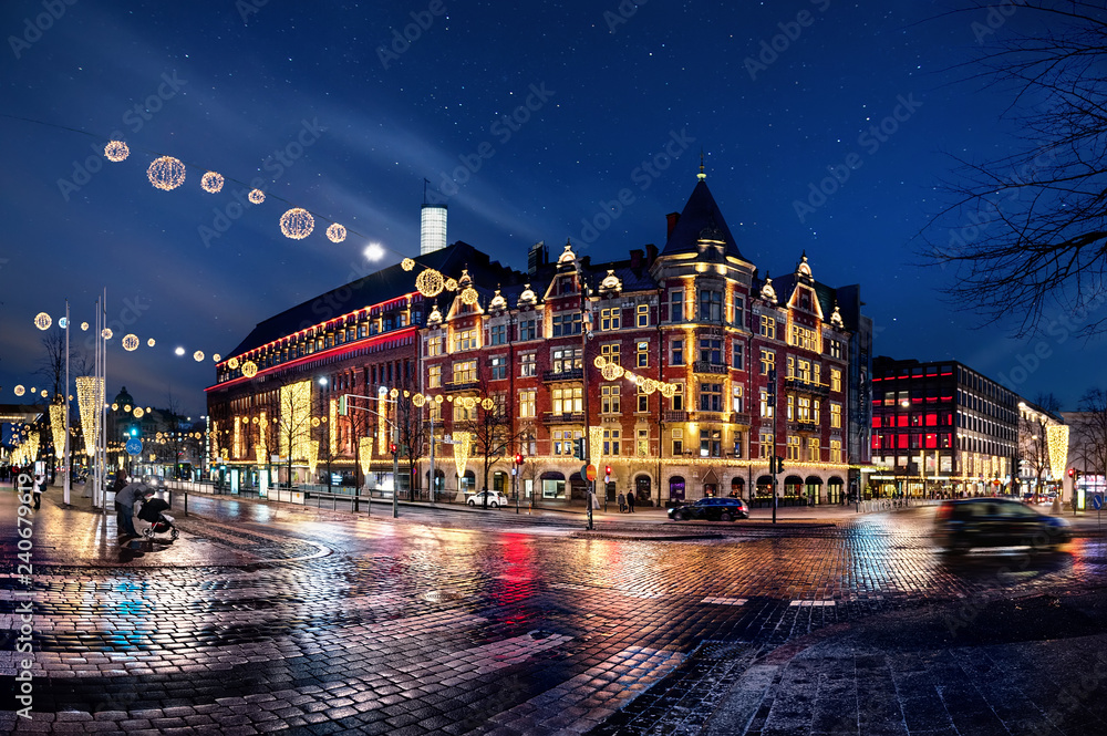 Obraz na płótnie City night scenes with glowing decorations and wet asphalt in Finland, Helsinki w salonie