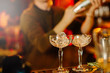 © callisto - Glasses with ice. The barman is preparing strong alcoholic beverages.