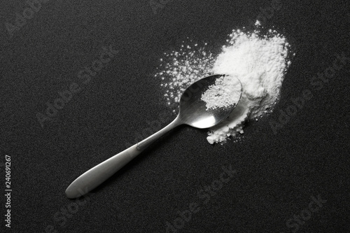 Fotografie, Obraz Spoon and cocaine powder on dark background, top view