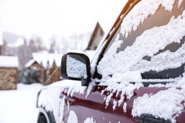 Car covered with snow after storm outdoors on beautiful winter day, closeup