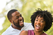 © digitalskillet1 - Happy African American couple laughing and smiling.